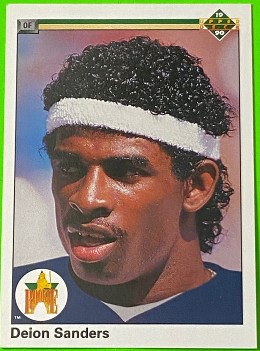 A collectible sports card featuring New York Yankees player Deion Sanders wearing a white headband, with the Upper Deck brand logo at the bottom.